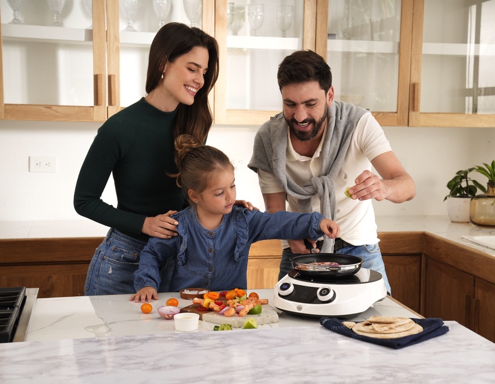 A family cooking with Royal Prestige products.